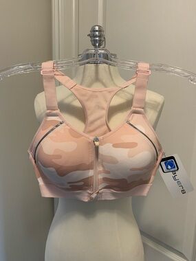 Layer 8 High-Impact sports bra with a pink camouflage design and a front zipper.